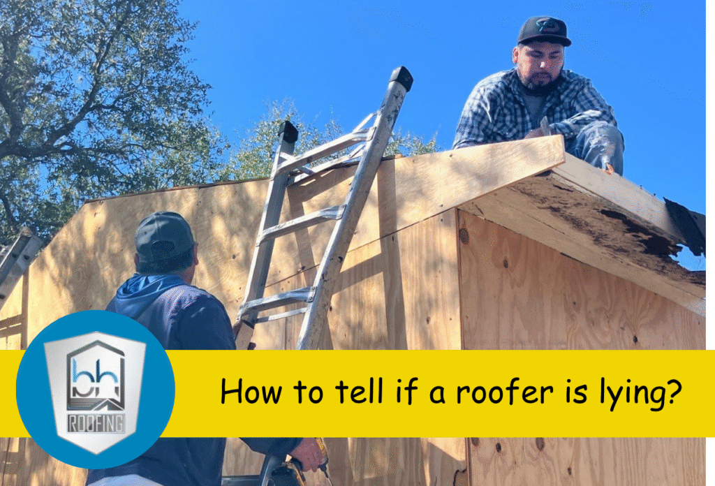 Two roofers working atop a wooden roof under clear blue sky.