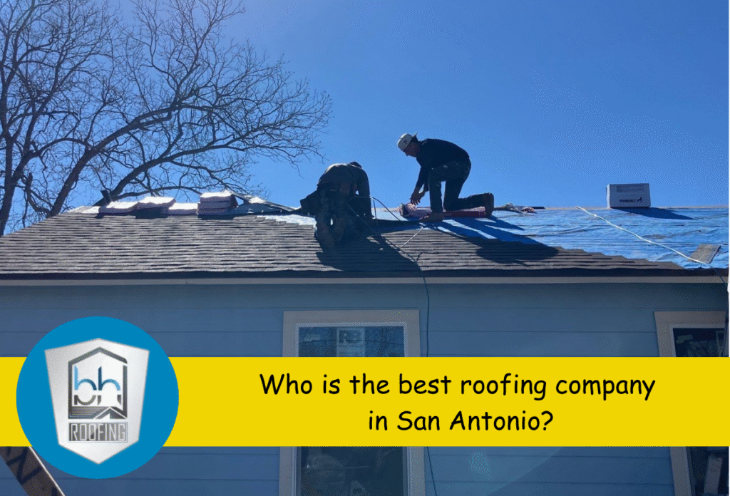 Roofers working on a house under clear blue sky with company logo visible.